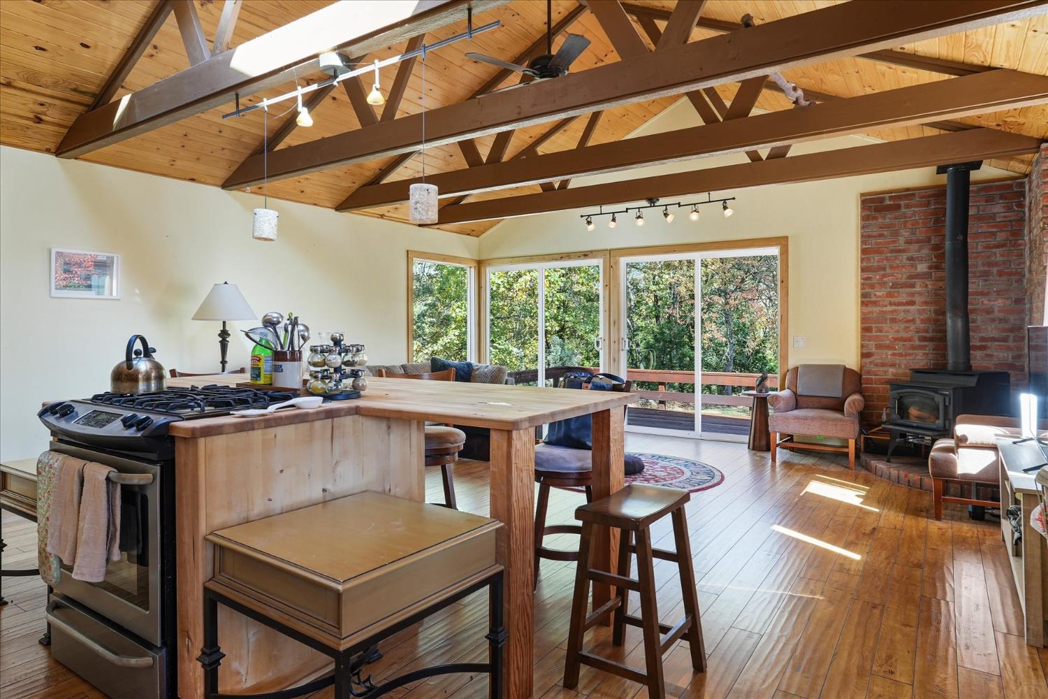 59484 Cascadel Road North Fork, CA 93643 - Photo 63 of 95 a kitchen with stainless steel appliances granite countertop a stove a refrigerator a dining table and chairs with the ocean view