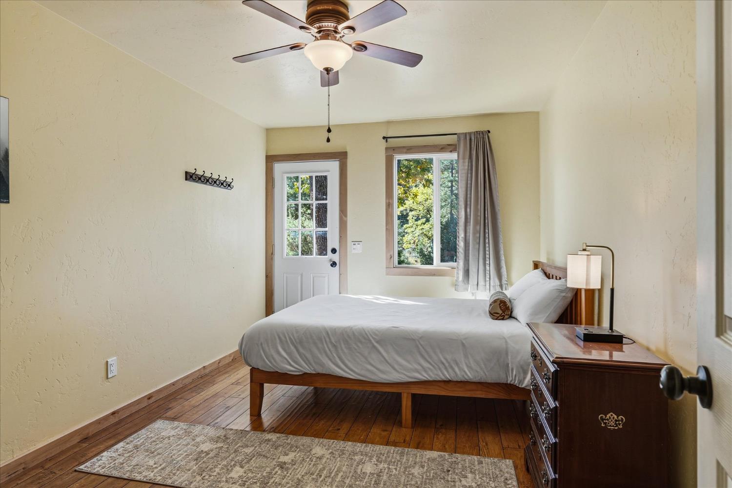 59484 Cascadel Road North Fork, CA 93643 - Photo 72 of 95 a bedroom with a bed and a chandelier