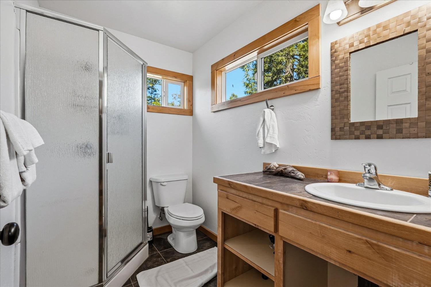 59484 Cascadel Road North Fork, CA 93643 - Photo 74 of 95 a bathroom with a granite countertop sink mirror vanity and toilet