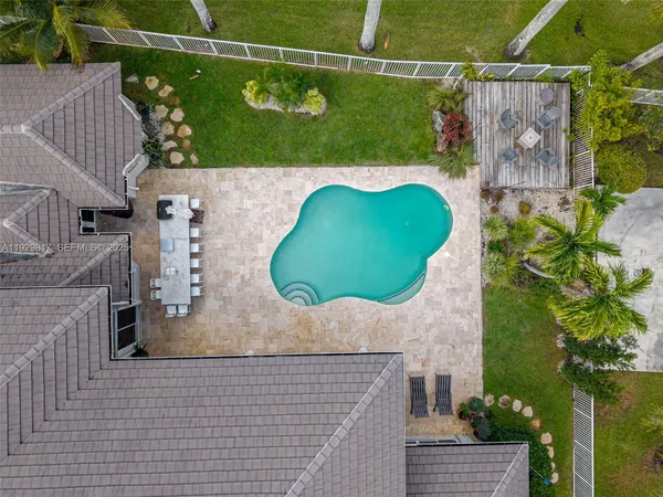 a view of a house with backyard porch and sitting area