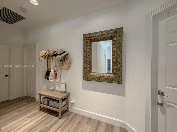 a view of a patio with a table and chairs