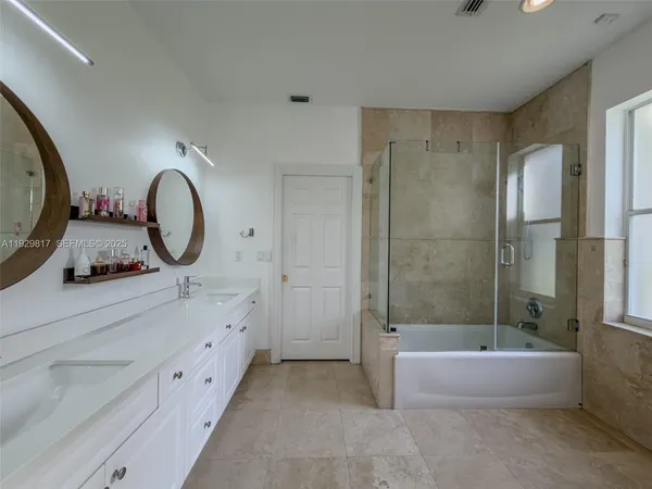 a view of a patio with dining table and chairs