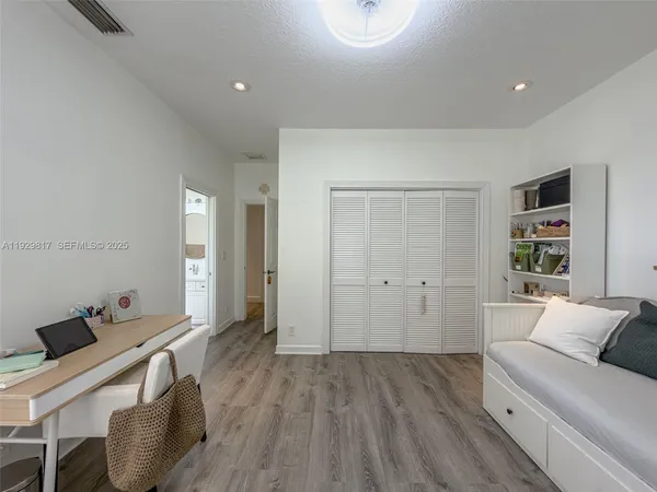 a view of a house with a swimming pool and a yard