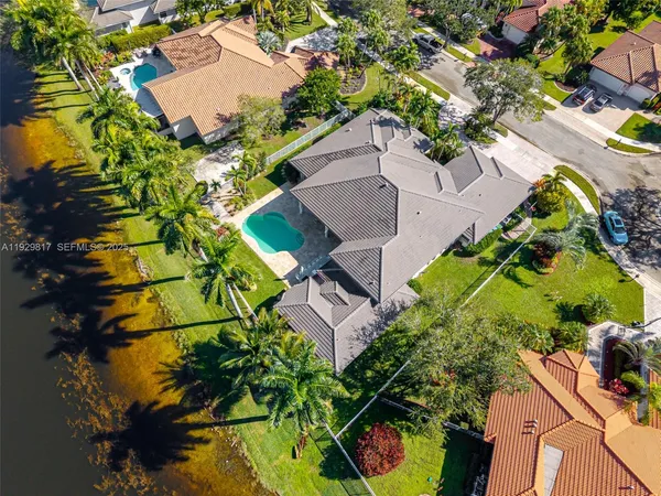 an aerial view of a house with a yard