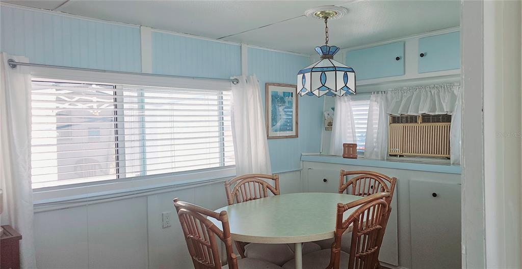10315 Cortez Road West, Unit 714 Bradenton, FL 34210 - Photo 13 of 26 a view of a dining room with furniture window and outside view