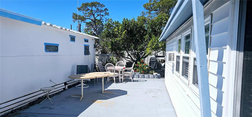 10315 Cortez Road West, Unit 714 Bradenton, FL 34210 - Photo 2 of 26 a view of a patio with chairs and potted plants