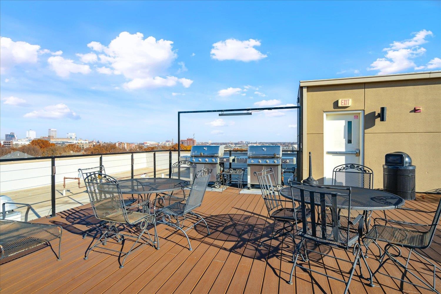 648 Riverside Drive, Unit 411 Memphis, TN 38103 - Photo 26 of 32 a view of a balcony with chairs and wooden floor