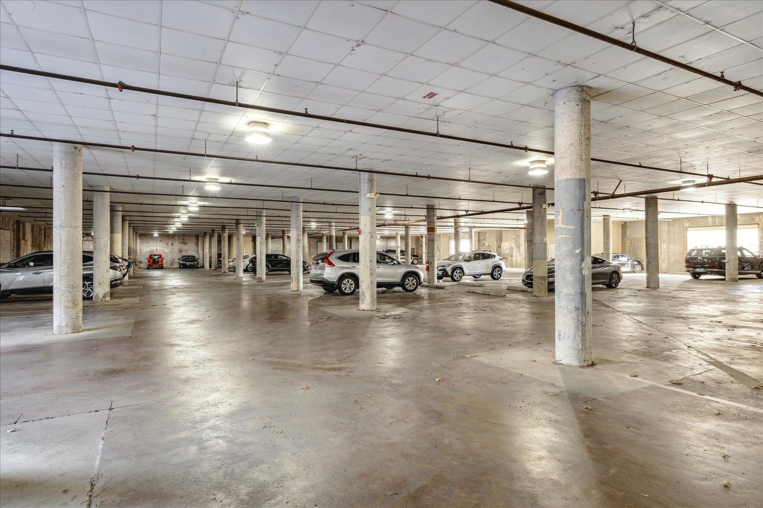 648 Riverside Drive, Unit 411 Memphis, TN 38103 - Photo 29 of 32 a view of a hall with lots of gym equipment