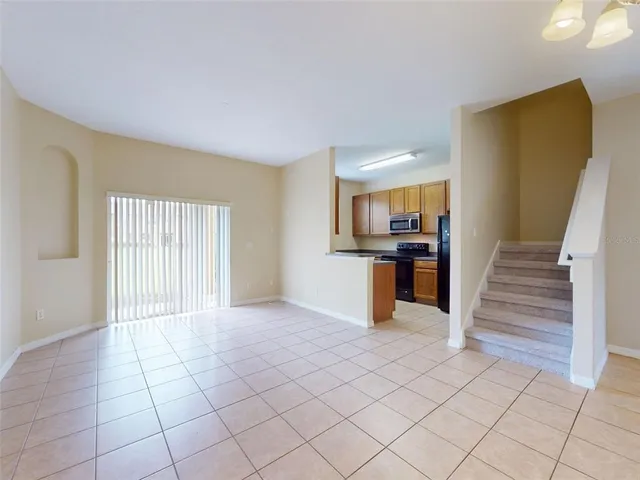a view of a kitchen with wooden floor and a kitchen