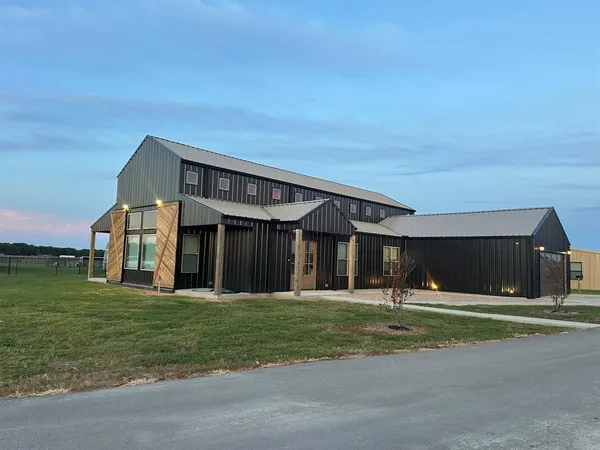 a front view of building with yard