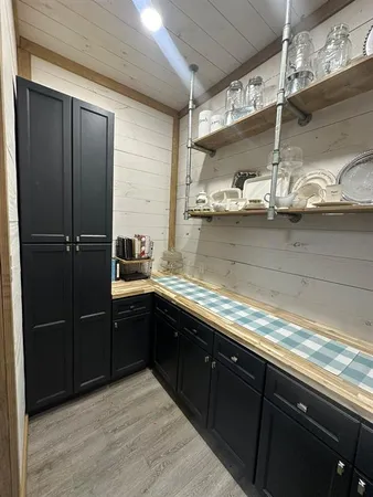 a kitchen with a sink and cabinets