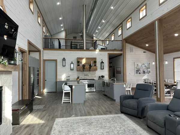 a living room with lots of furniture and a fireplace
