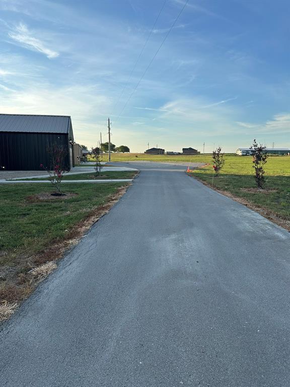 511 John Davis Road Italy, TX 76651 - Photo 25 of 40 a view of a town with big yard and large tree