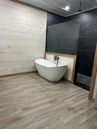 a bathroom with a bathtub and toilet