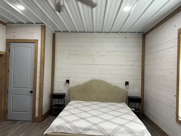 a living room with a fireplace furniture and a flat screen tv