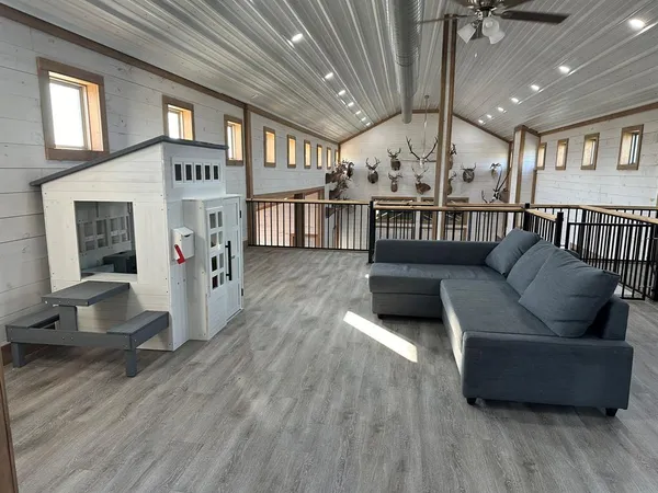 a view of a livingroom with furniture and window