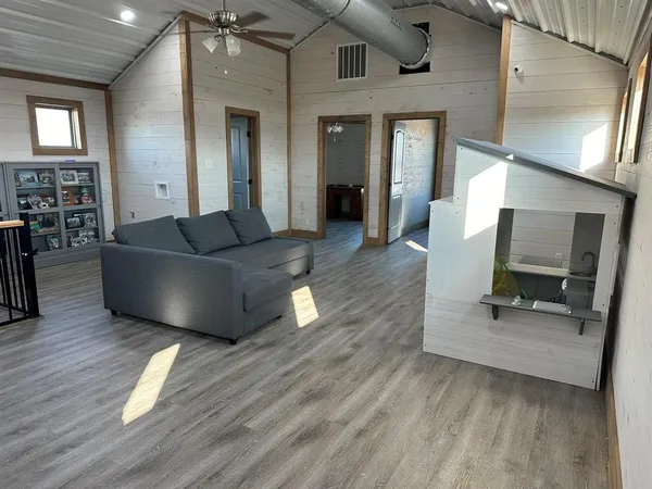 a view of gallery with wooden floor