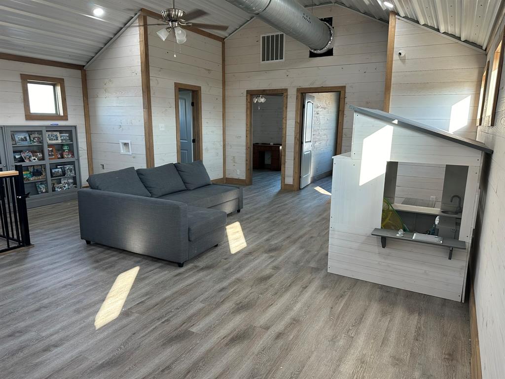 511 John Davis Road Italy, TX 76651 - Photo 36 of 40 a living room with furniture and a wooden floor