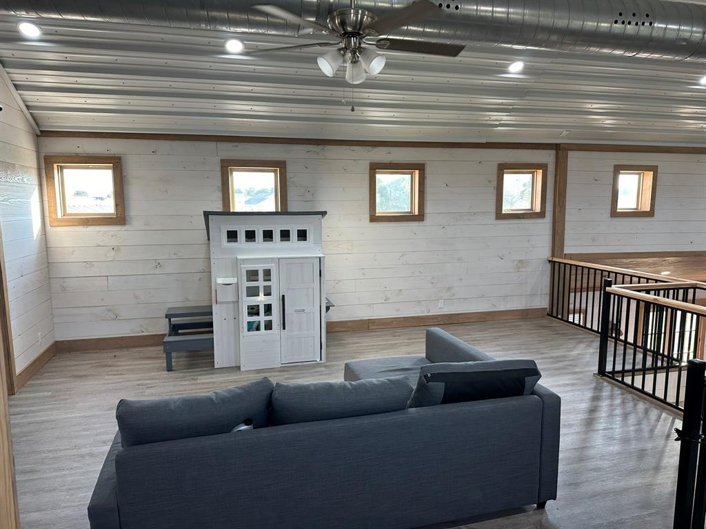 511 John Davis Road Italy, TX 76651 - Photo 38 of 40 a living room with furniture and a fireplace