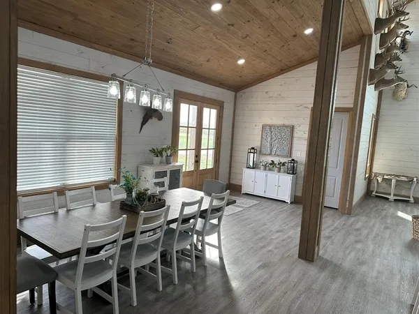 a view of a dining room with furniture and window
