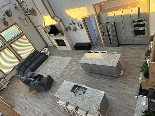a living room with couches and flat screen tv
