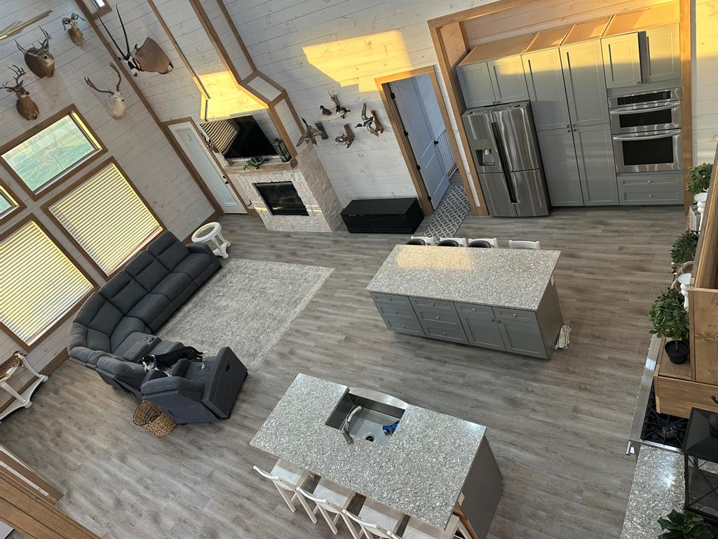 511 John Davis Road Italy, TX 76651 - Photo 9 of 40 a living room with couches and flat screen tv