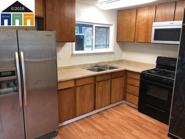 669 Brannan Island Road Isleton, CA 95641 - Photo 5 of 5 a kitchen with a refrigerator stove and microwave