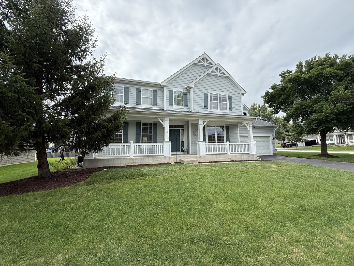 256 Monument Road Elgin, IL 60124 - Photo 1 of 2 a front view of a house with a garden