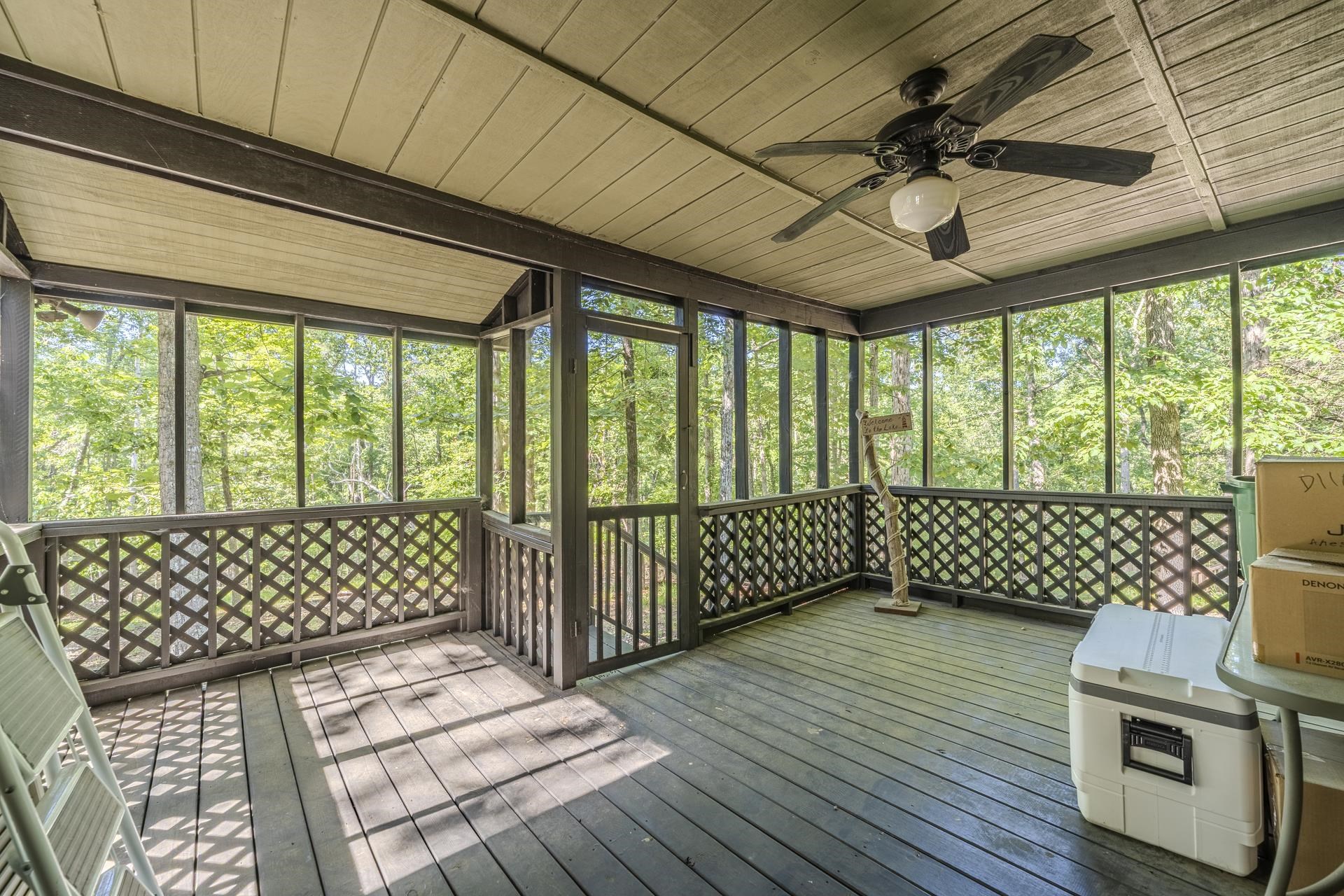 435 Murray Lane Counce, TN 38326 - Photo 31 of 34 Expansive screened porch with wood-finish flooring, a wood plank ceiling, and a ceiling fan