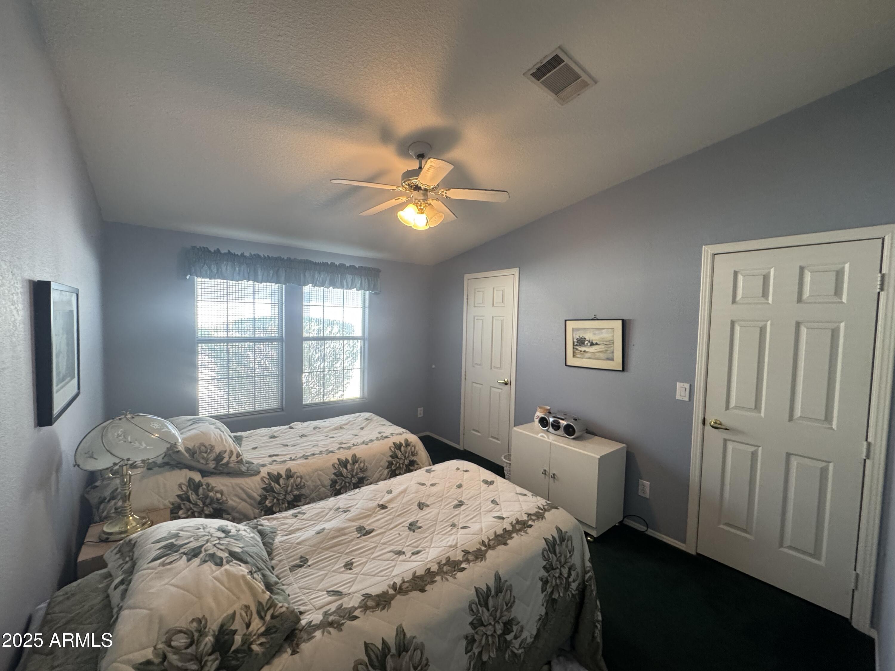 215 North Power Road, Unit 199 Mesa, AZ 85205 - Photo 16 of 27 a bedroom with a bed and a window