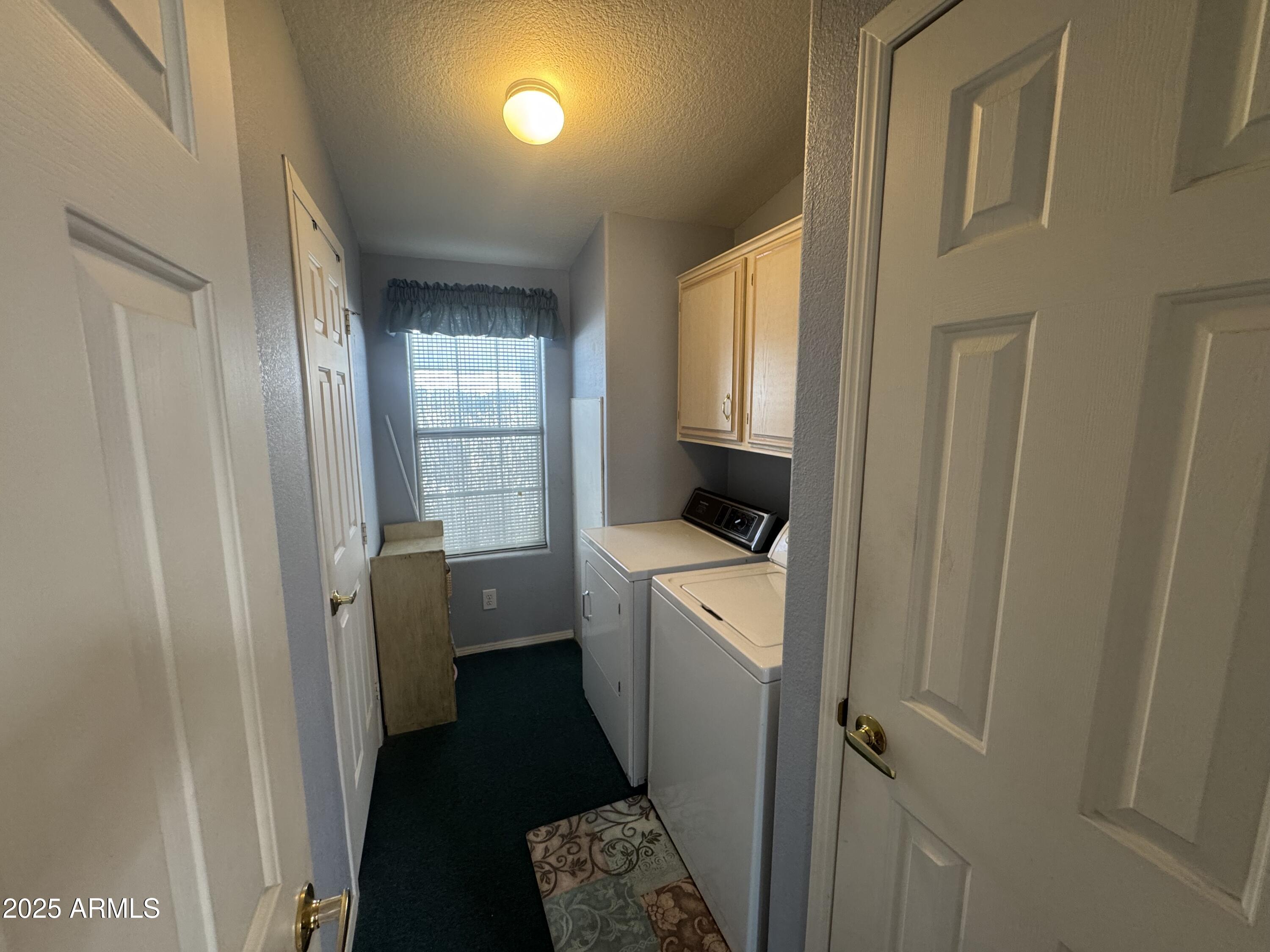 215 North Power Road, Unit 199 Mesa, AZ 85205 - Photo 17 of 27 a room with a washer and dryer
