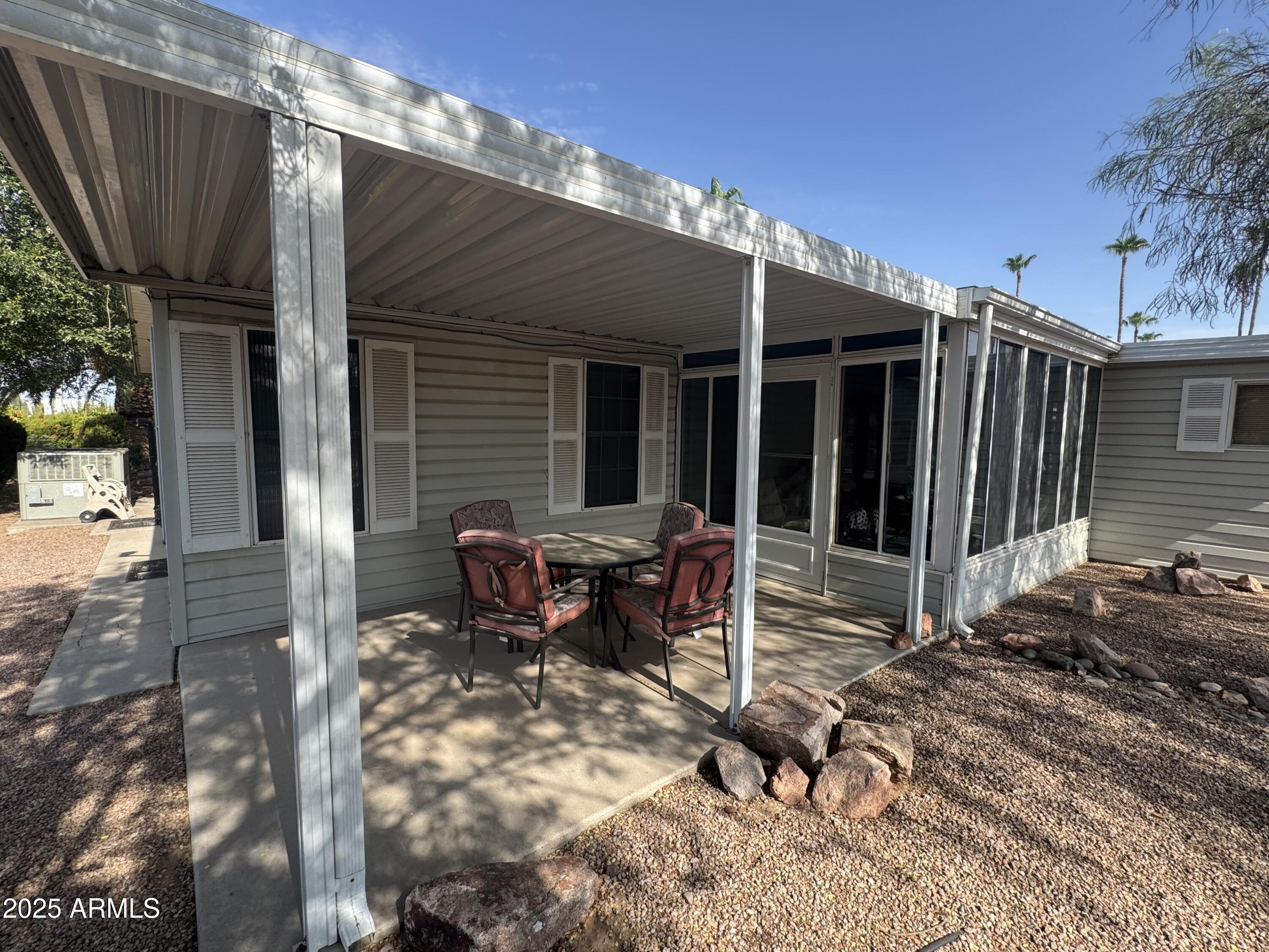 215 North Power Road, Unit 199 Mesa, AZ 85205 - Photo 21 of 27 a backyard of a house with yard and outdoor seating