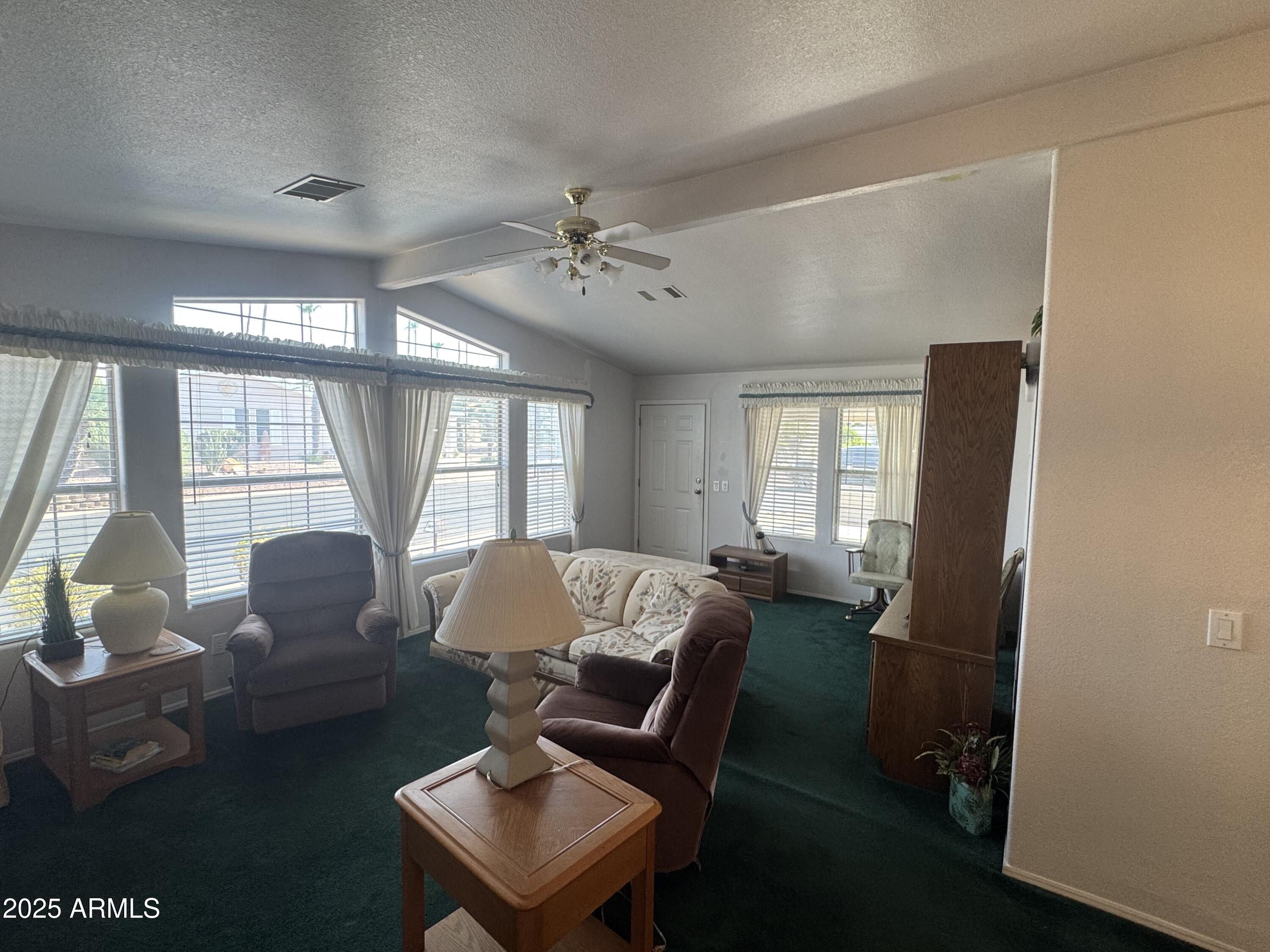 215 North Power Road, Unit 199 Mesa, AZ 85205 - Photo 4 of 27 a living room with furniture and a window