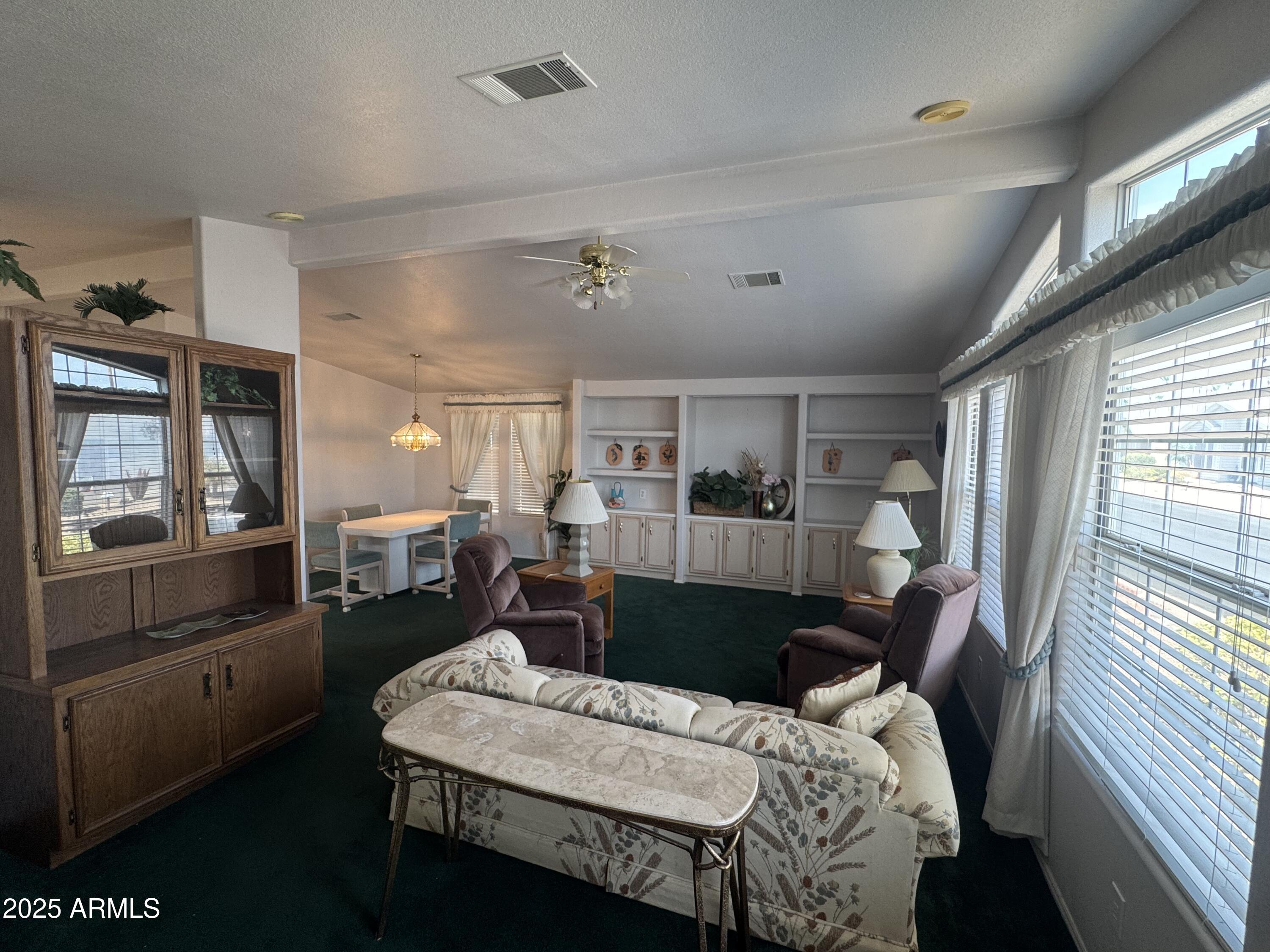 215 North Power Road, Unit 199 Mesa, AZ 85205 - Photo 5 of 27 a view of a dining room with furniture and window
