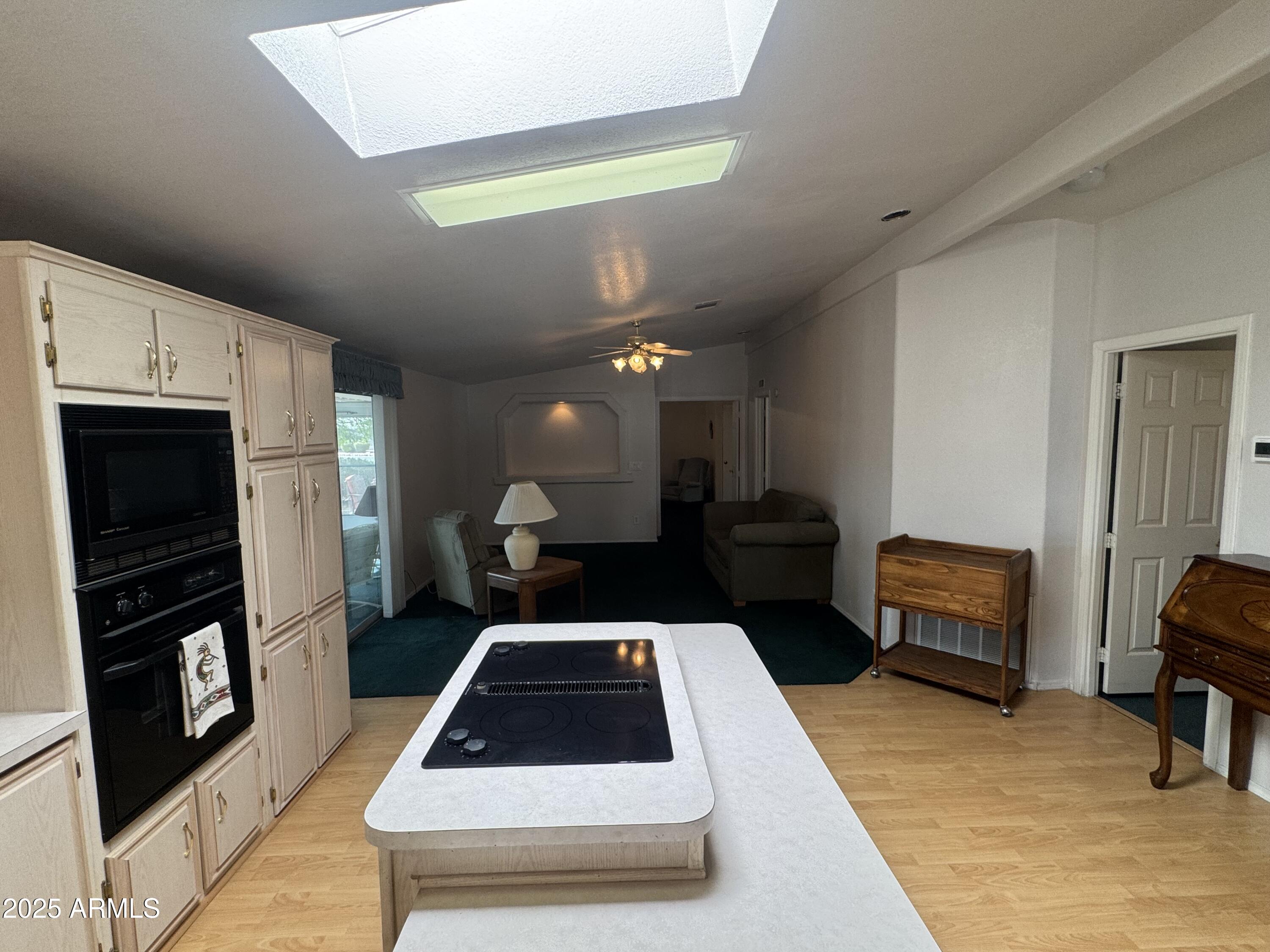 215 North Power Road, Unit 199 Mesa, AZ 85205 - Photo 10 of 27 a kitchen with a refrigerator and a stove top oven