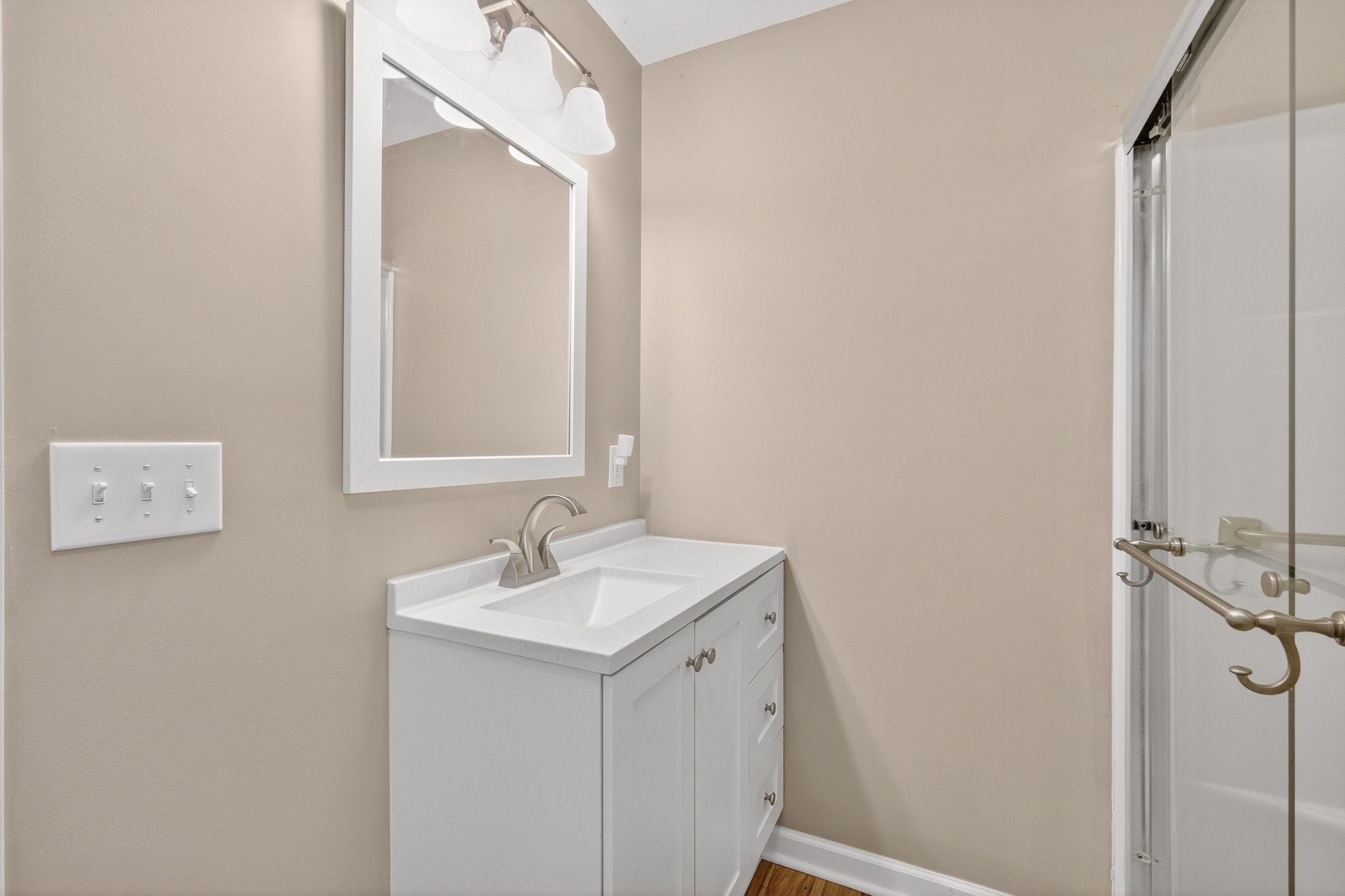 11914 Hogwood Road Milton, TN 37118 - Photo 26 of 44 a bathroom with a sink a mirror and shower