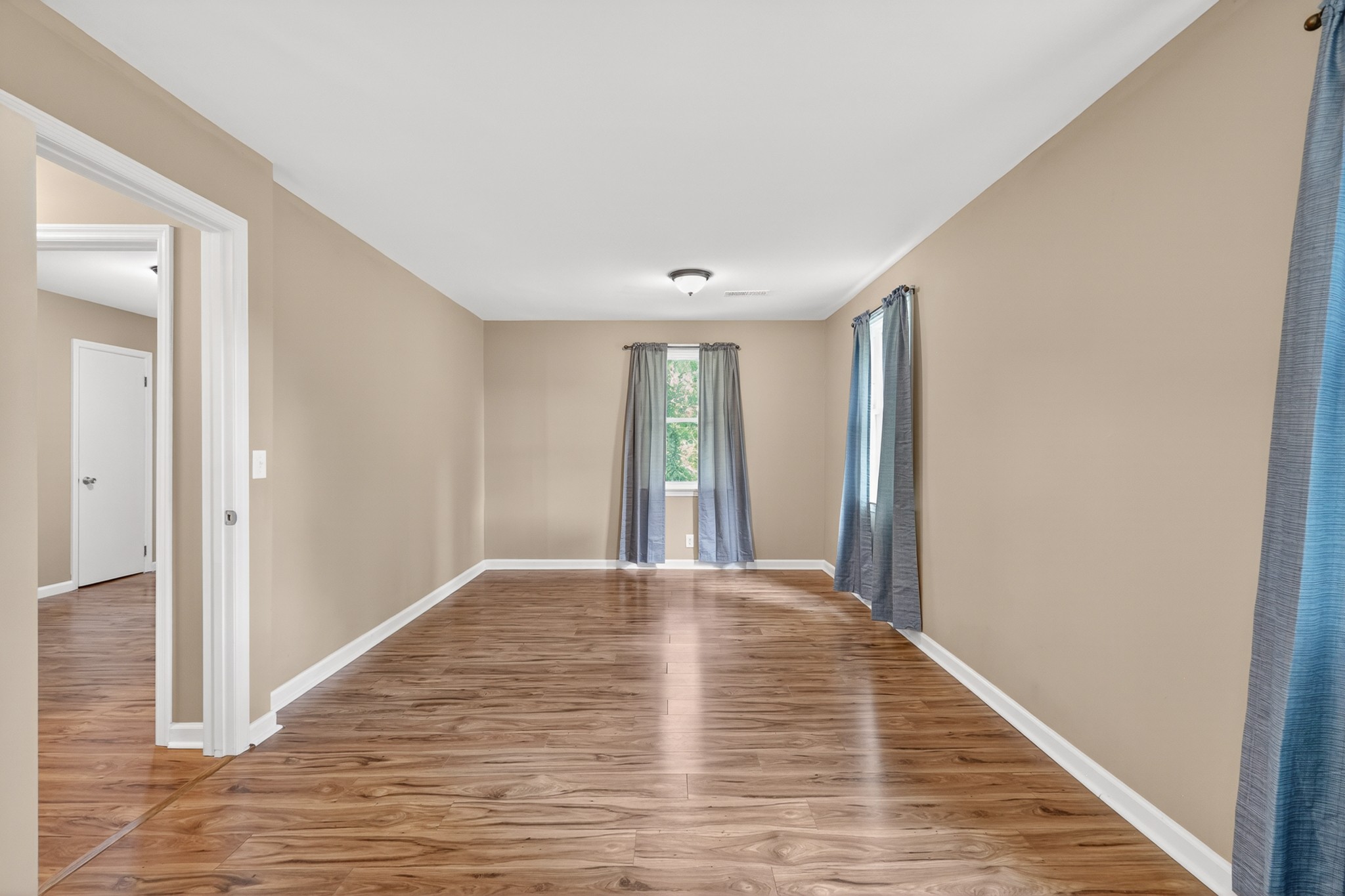 11914 Hogwood Road Milton, TN 37118 - Photo 29 of 44 a view of an empty room with wooden floor