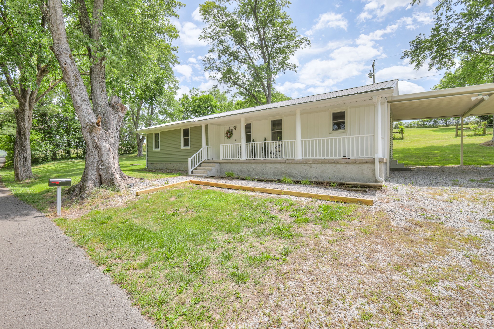 11914 Hogwood Road Milton, TN 37118 - Photo 3 of 44 a view of a house with backyard and a tree