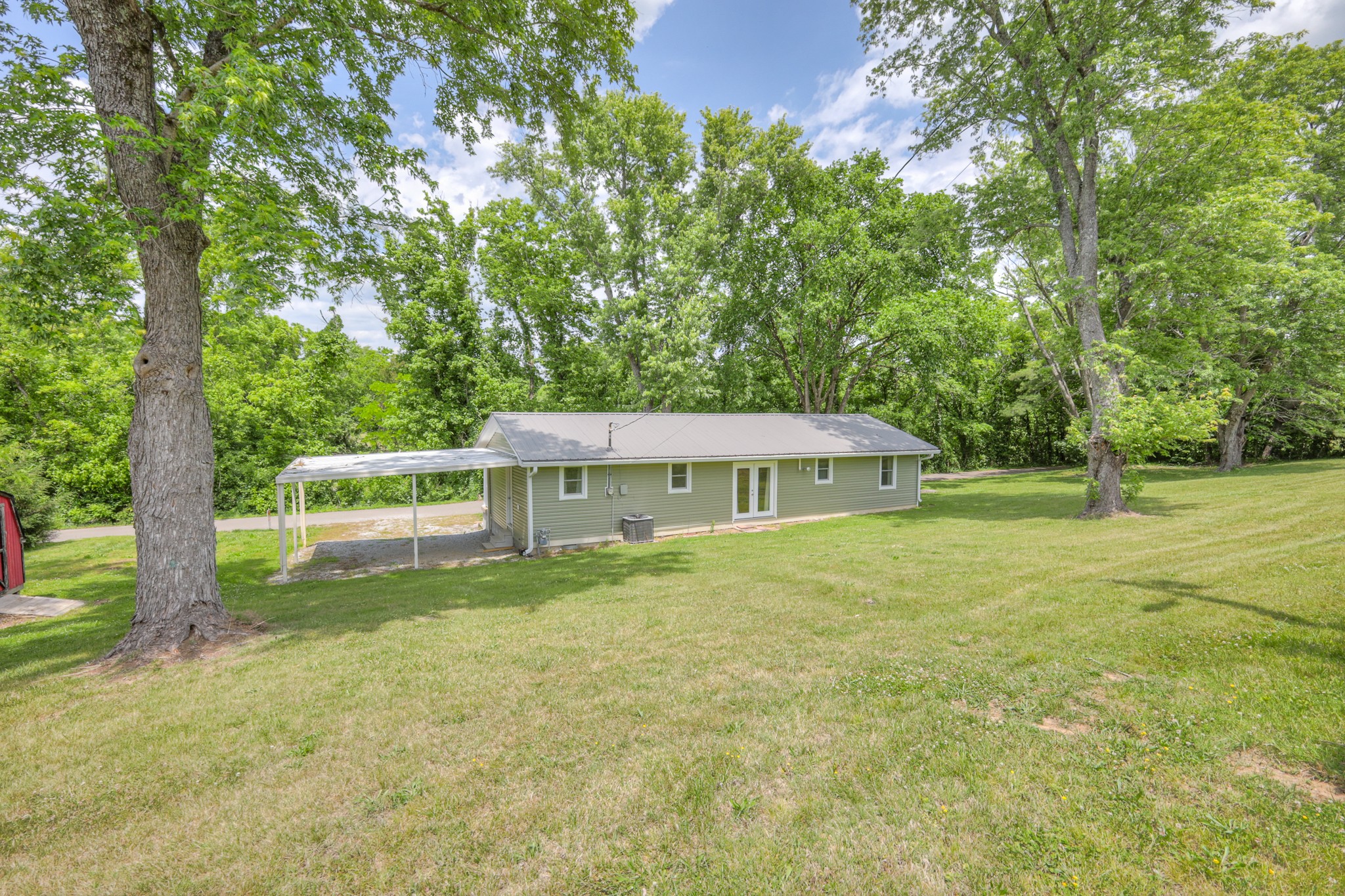 11914 Hogwood Road Milton, TN 37118 - Photo 33 of 44 a view of a house with a yard and sitting area