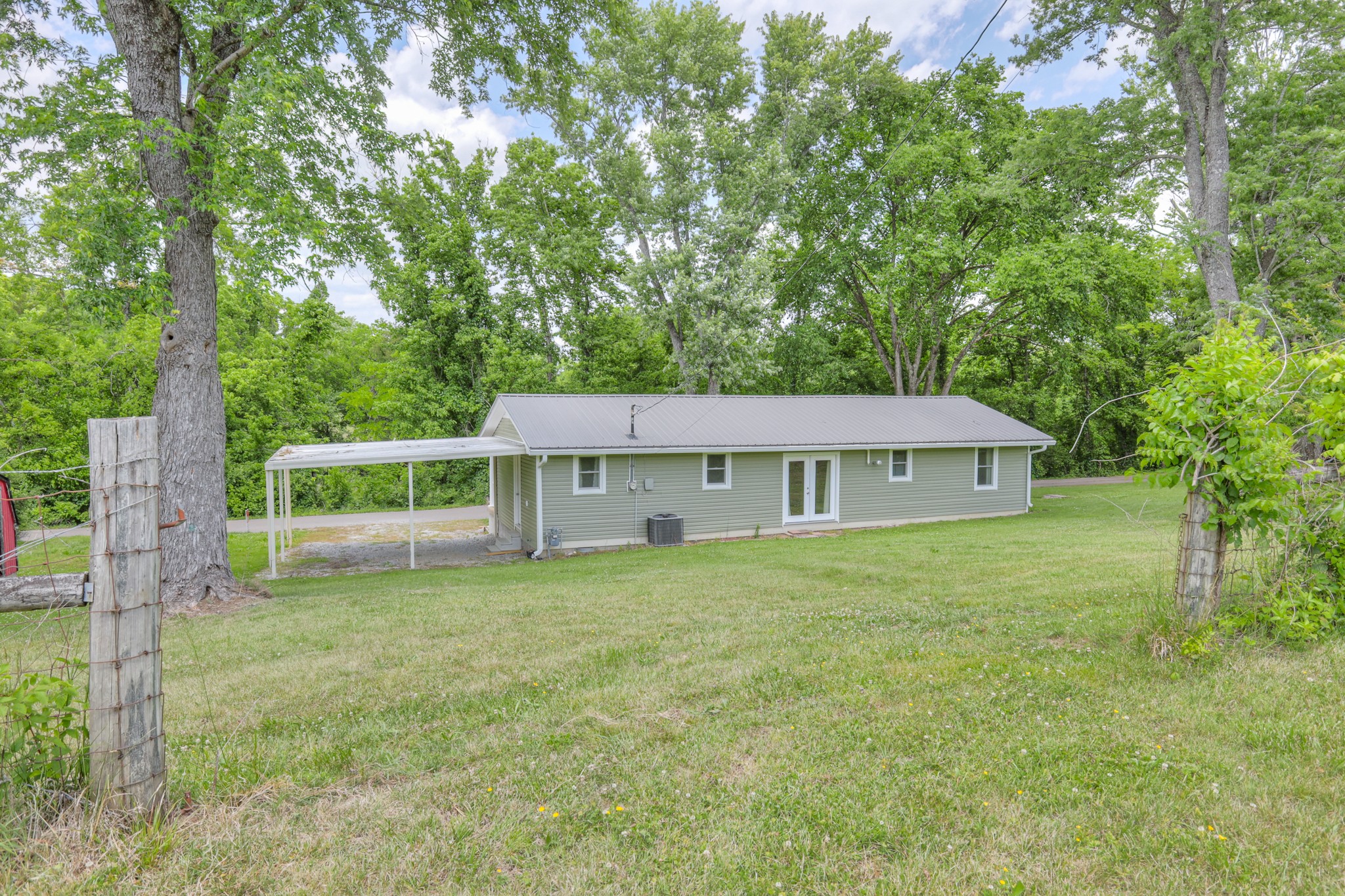 11914 Hogwood Road Milton, TN 37118 - Photo 36 of 44 a view of a house with a yard