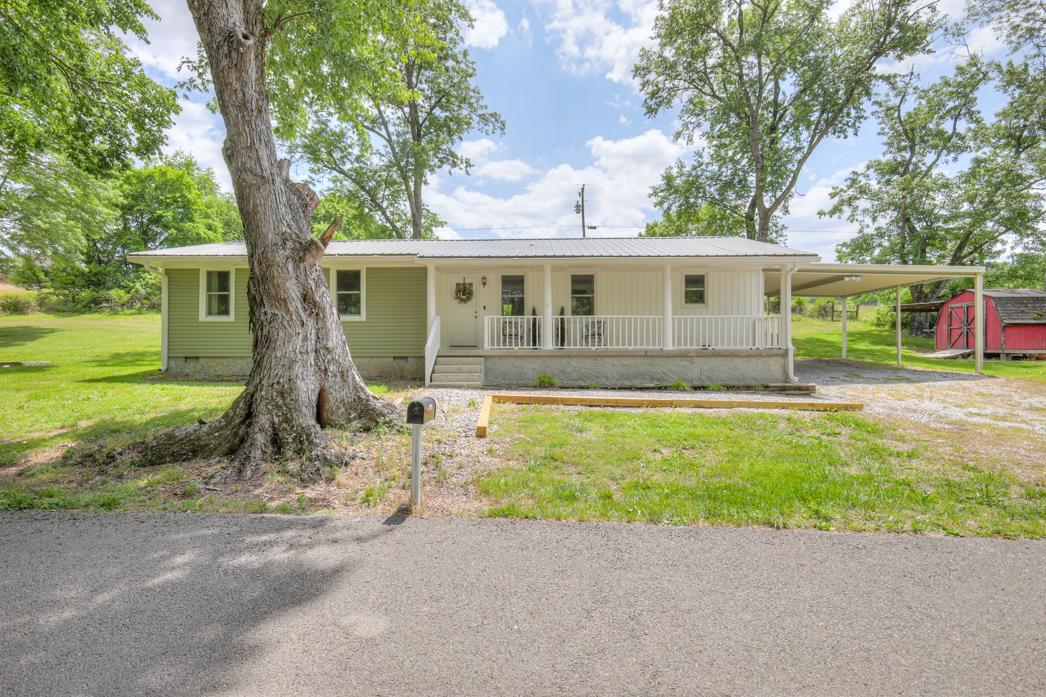 11914 Hogwood Road Milton, TN 37118 - Photo 6 of 44 front view of a house with a yard