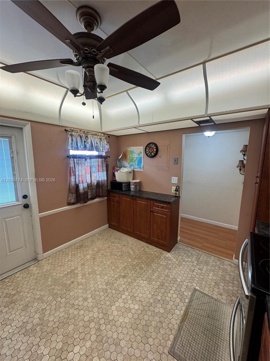 6731 Cypress Road, Unit 410 Plantation, FL 33317 - Photo 12 of 15 a kitchen with a stove and a refrigerator
