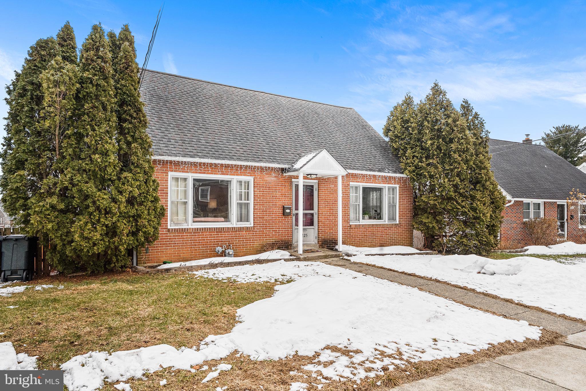 225 McClellan Street Reading, PA 19611 - Photo 2 of 25 a front view of a house with a yard