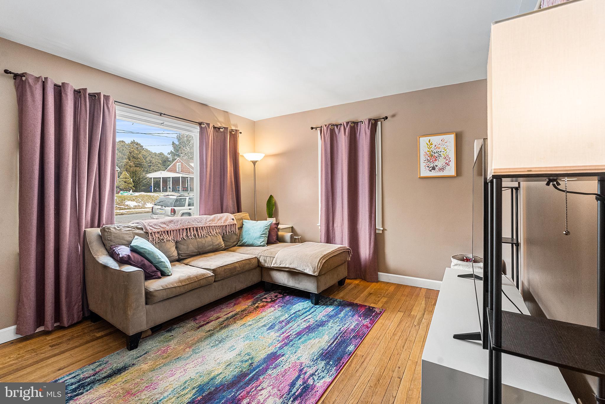225 McClellan Street Reading, PA 19611 - Photo 5 of 25 a living room with furniture and a window