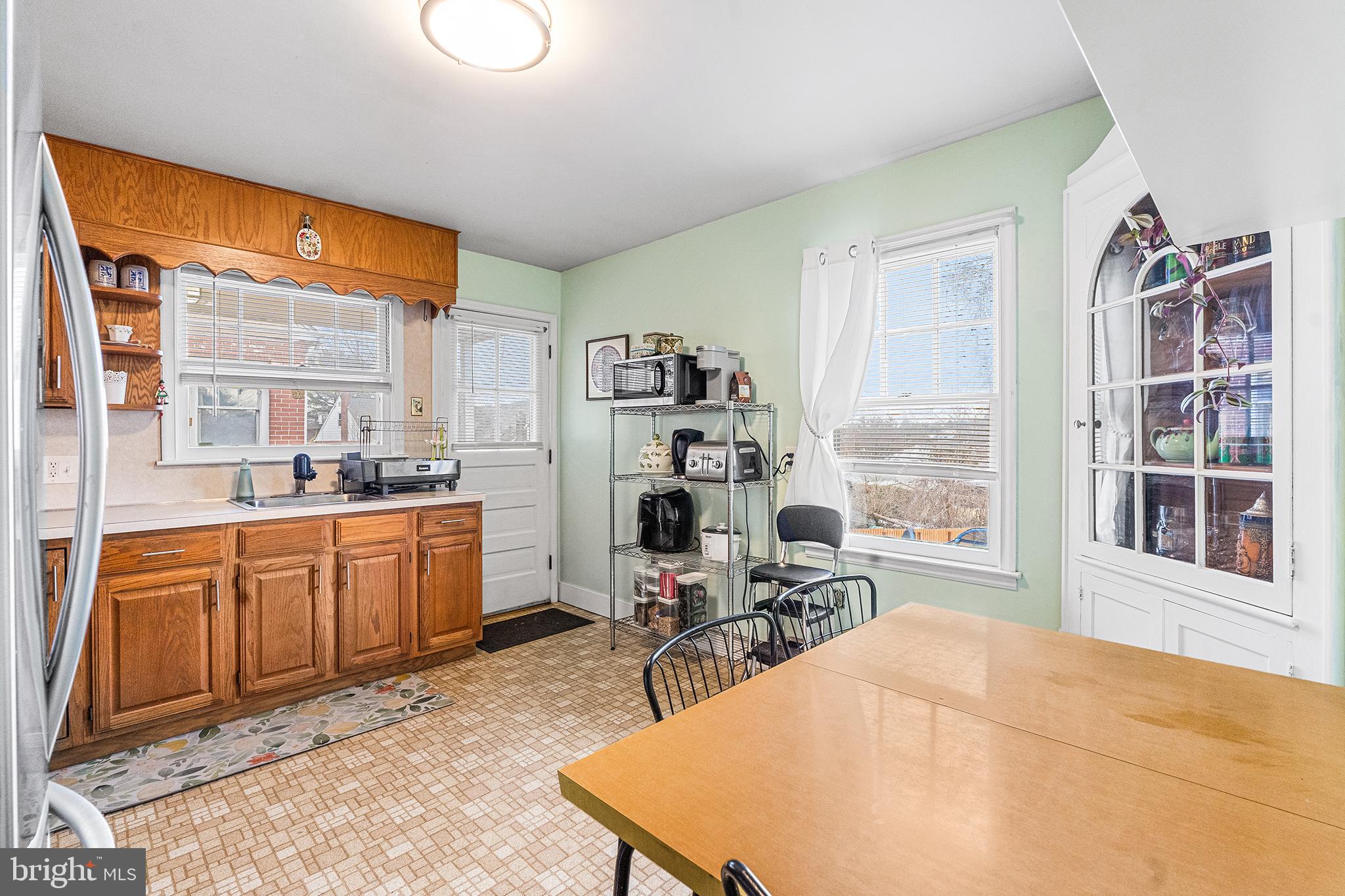 225 McClellan Street Reading, PA 19611 - Photo 6 of 25 a room with stainless steel appliances kitchen island granite countertop a refrigerator and cabinets