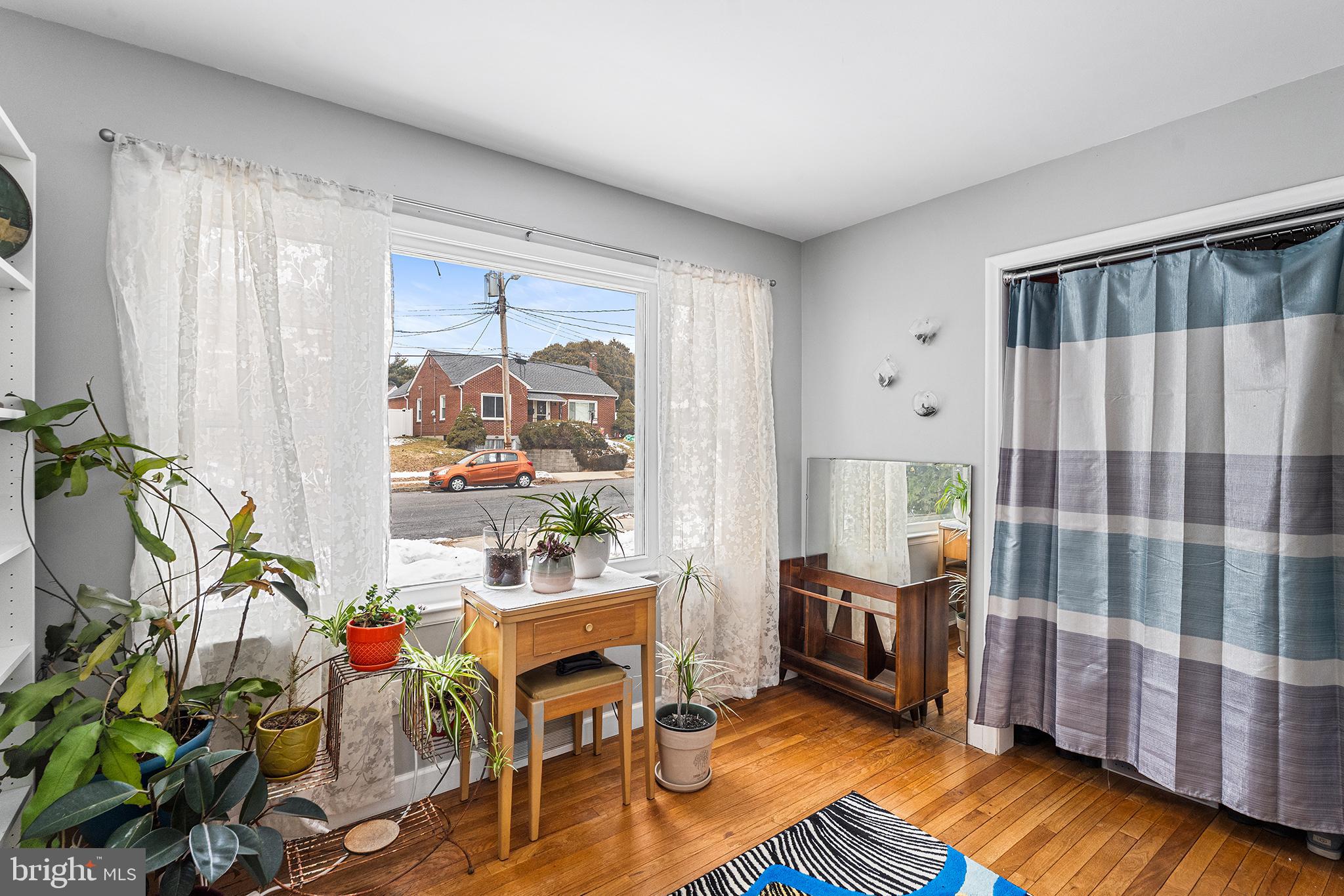 225 McClellan Street Reading, PA 19611 - Photo 10 of 25 a living room with furniture and a potted plant