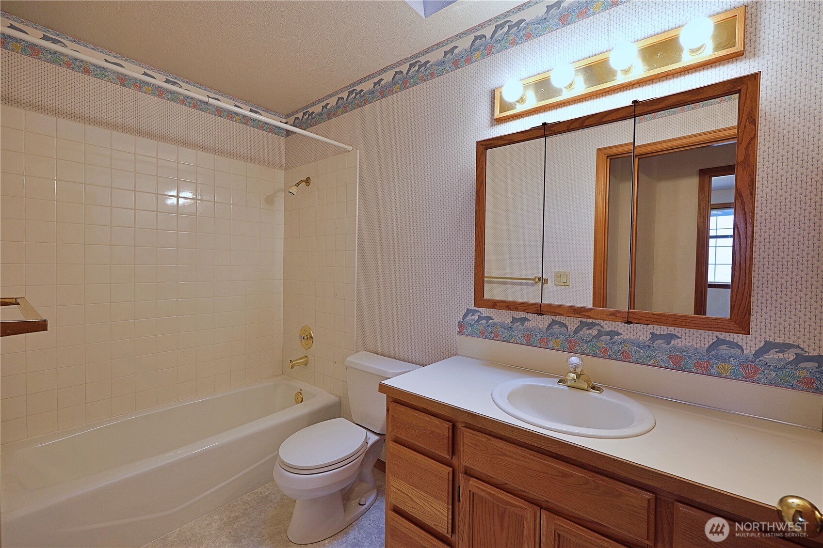 424 16th Street Southwest Puyallup, WA 98371 - Photo 20 of 39 a bathroom with a granite countertop sink a toilet a mirror and shower