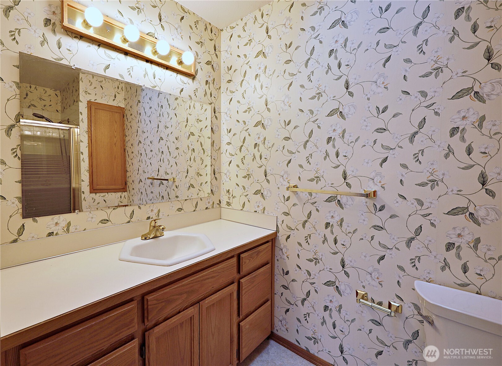 424 16th Street Southwest Puyallup, WA 98371 - Photo 29 of 39 a bathroom with a sink and a mirror