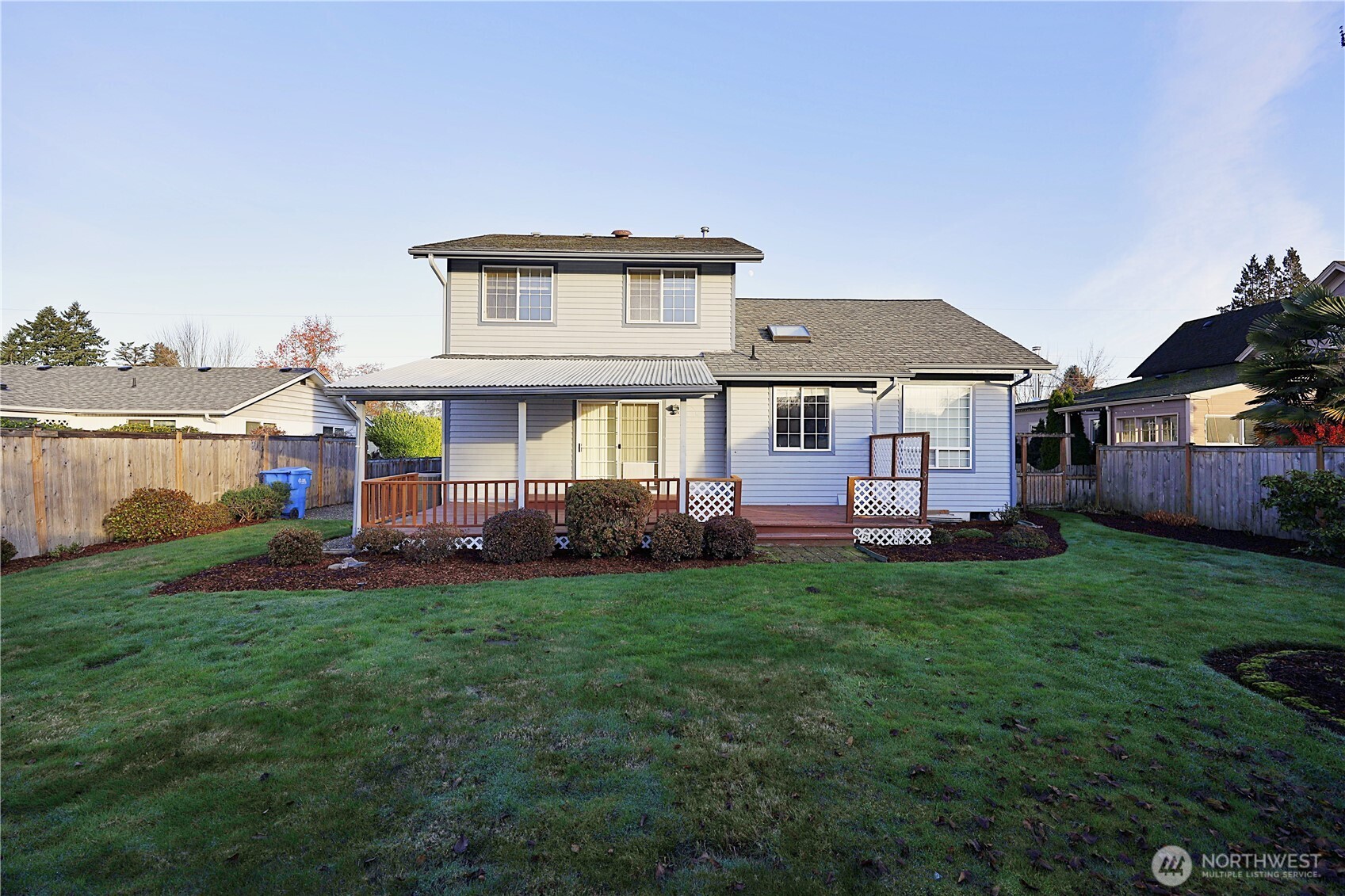 424 16th Street Southwest Puyallup, WA 98371 - Photo 35 of 39 a front view of a house with a garden and lake view