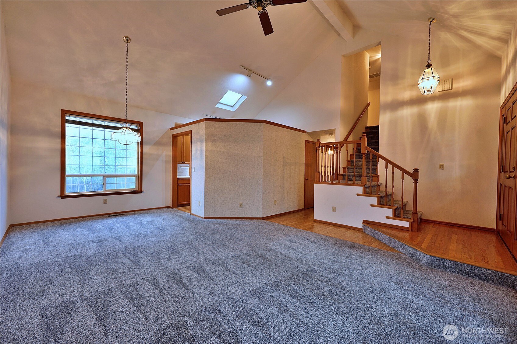 424 16th Street Southwest Puyallup, WA 98371 - Photo 6 of 39 a view of an empty room with a window and wooden floor
